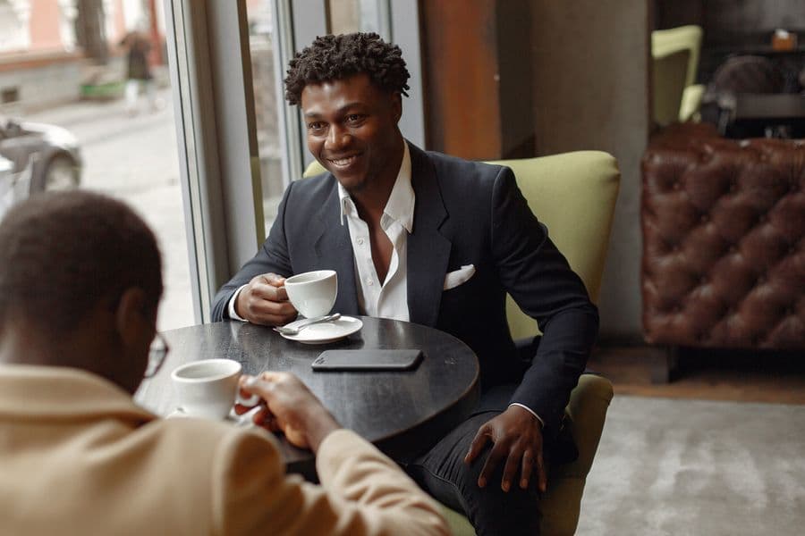 Two professionals discussing business across a table